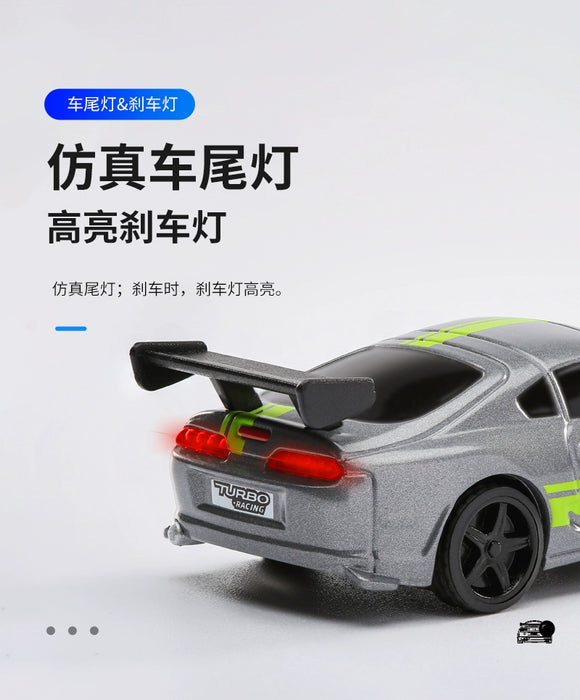 A close-up image of a Lacatang Shop Turbo1/76 Miniature RC Remote Control Electric Sports Car C71 C72 C73, designed to simulate a miniature Toyota. The silver toy car features lime green stripes on the roof and sides, along with a prominent spoiler and detailed rear bumper. Chinese text highlights the high brightness of its realistic taillights and brake lights. Various logos and text are also present on the car.