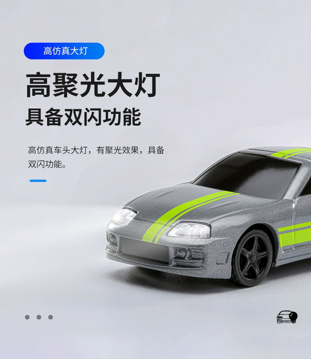 A Turbo1/76 Miniature RC Remote Control Electric Sports Car from Lacatang Shop, featuring bright headlights and a dual-flash feature, is displayed against a gradient gray background. The silver Toyota Bull Devil, complete with green racing stripes, promises thrilling TURBO RACING excitement. Chinese text details the headlights and other features, while an icon of a steering wheel appears at the bottom.