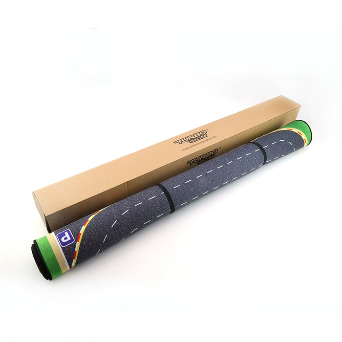 A rolled-up indoor cycling trainer mat featuring green and yellow striped ends is shown. The design resembles a Turbo Drift Remote Control Car Track by Lacatang Shop, with a rectangular box labeled "Turbo" in black text.