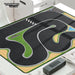 Experience thrilling races with the Lacatang Shop's Turbo Remote Control Drift Car Track for All Ages, featuring a winding black track with green borders, a checkered start/finish line, and a pond. Perfect for drift sessions on your white table near your black device.