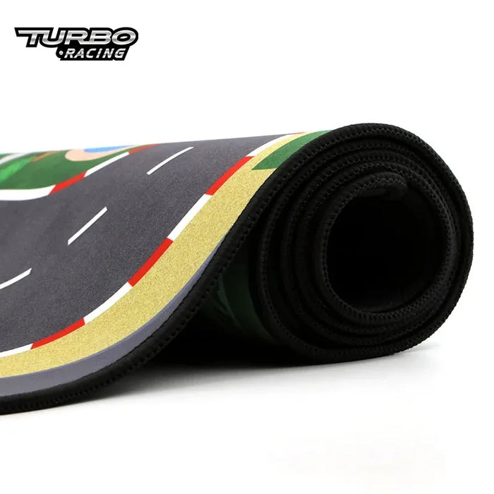 The Large Portable Turbo Racing Rubber Mat by Lacatang Shop showcases a detailed road design with lanes and borders, perfect for 1:76 RC Mini Cars. The "Turbo Racing" logo is visible on this 160x90cm or 180x80cm mat, making it ideal for miniature racing enthusiasts.