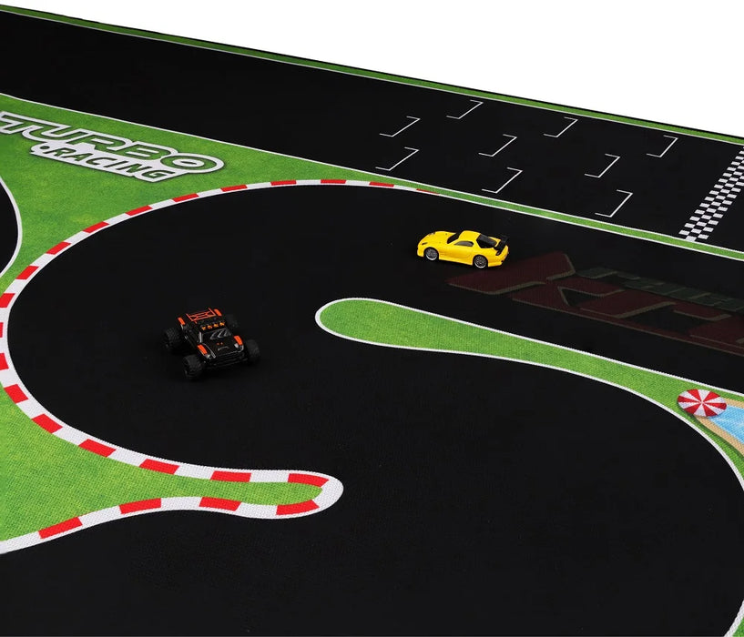 The Lacatang Shop Portable Turbo Racing Rubber Track Mat (1600x900mm) for 1:76 RC mini cars features a black surface with red and white borders, lush green areas, and bold "TURBO RACING" text. It includes two racers, one yellow and the other black with orange accents.