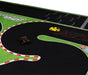 Two mini scale cars, one black and one yellow, are on the Lacatang Shop's Portable Turbo Racing Track Mat (1600x900mm). The black track boasts red and white borders with green surroundings, featuring a visible finish line in the background.