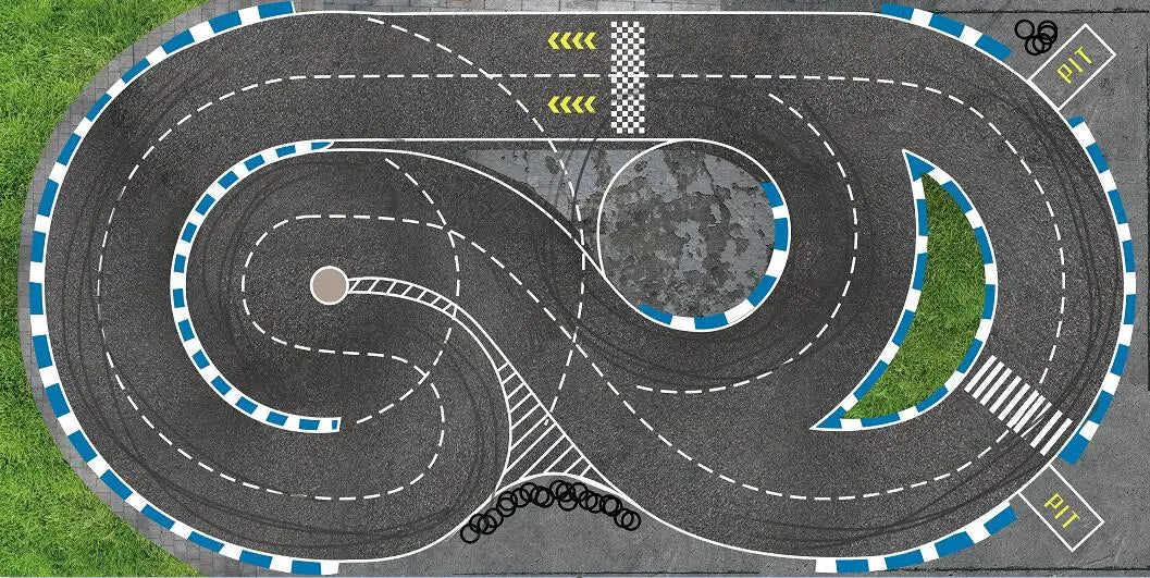 Aerial view of the 3.2 Meter RC Drift Track by Lacatang Shop reveals a gray, figure-eight course with blue and white barriers for Mini-Z models. It includes curves, a start/finish line, and a pit stop area, set amidst vibrant green grass with tire skid marks at the intersections.