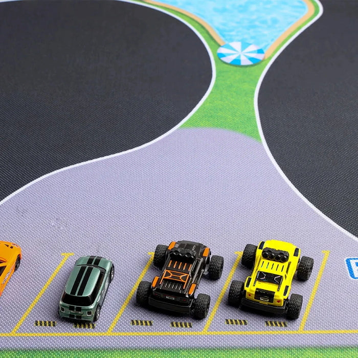 Toy cars line up on the Lacatang Shop's vibrant Portable 1/76 Scale Turbo Racing Rubber Mat, designed with roads, green spaces, and a blue pond for a realistic track experience. Available in 160x90cm & 180x80cm sizes, this mat is perfect for an exciting RC mini car racing event.