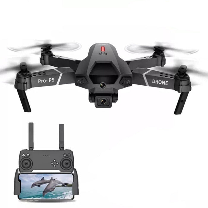 A sleek black Yellow Pandora Ninja Dragon Phantom X HD Dual Camera Smart Quadcopter Drone in flight with dual cameras and foldable arms. Four propellers buzz as the camera faces forward, capturing a live video feed of dolphins swimming in the ocean, displayed on the screen of its remote control below. The background is white.