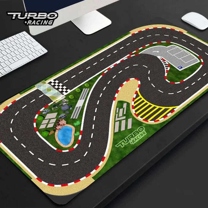 The Lacatang Shop's Large 160x90cm Turbo Racing Track Mat, perfect for a DIY racing setup, features a cartoon race track with winding roads, a checkered start/finish line, greenery patches, and parking spaces. Its high grip surface keeps it secure on your desk beside the keyboard.