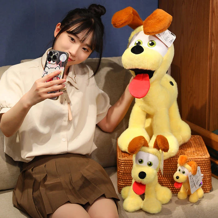 A person in a beige shirt and brown skirt takes a selfie with a phone featuring Kawaii Oudi Dog. They sit beside three Lacatang Shop's Kawaii Oudi Dog plush toys, varying in size, with yellow bodies, brown ears, and big eyes on a wooden bench. The plushies exude adorable charm.