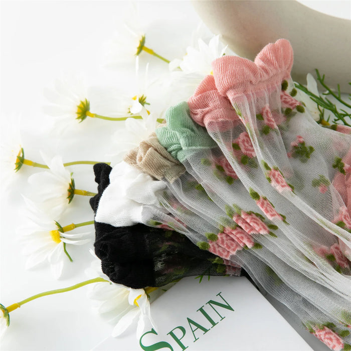 The Lacatang Shop offers Delicate Vintage Floral Lace Ruffle Socks in black, white, beige, green, and pink. Styled in Kawaii Harajuku fashion with crystal silk and ruffle hems, they're beautifully displayed with white daisies and a book showcasing "SPAIN.