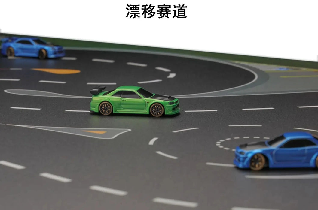 Toy cars traverse the TURBO RACING 1:76 Drift Track Mat by Lacatang Shop, focusing on the green car in the center while blue ones speed around. The track flaunts white dotted lines and directional arrows. Japanese text at the top attracts remote control enthusiasts to RC racing accessories.