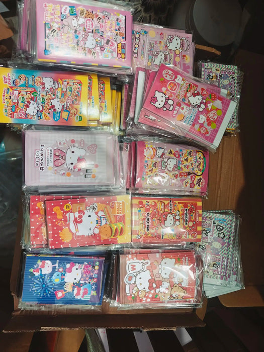 A neatly stacked box showcases various colorful Hello Kitty-themed bags and Lacatang Shop's Kawaii Hello Kitty Sealing Stickers, featuring a variety of kawaii designs with pink, yellow, and red hues, complete with Sanrio characters' illustrations. Suitable for ages 8+.