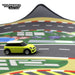 A small green toy car zooms across Lacatang Shop's Large 160x90cm Portable Turbo Racing Track Mat for 1:76 RC Mini Cars. The DIY-friendly high grip surface aids the car around turns effortlessly, while the "Turbo Racing" logo decorates the top left corner.