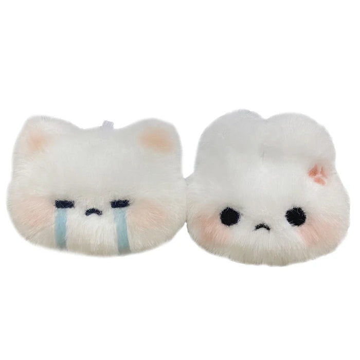 Two high-quality, fluffy Cartoon Plush Rabbit Doll Toy Keychains from Lacatang Shop. One features teary eyes with blue streaks beneath them and a sad expression, while the other has round black eyes and a neutral expression with a slight blush on its cheeks. Both keychains are made from soft plush material for added comfort, making them the perfect kawaii gift or accessory for bags and car keyrings.