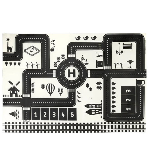 The Lacatang Shop's "City Traffic Play Mat for Babies" is a black-and-white educational mat featuring a winding road, numbers, a helicopter pad, train tracks, farm animals, hot air balloons, and traffic signs to introduce city traffic and road safety concepts.