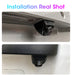 Close-up images show a Develuck HD 1080P 170° Fisheye Night Vision Car Rear View Camera, by Lacatang Shop, installed under a vehicle's rear. The camera is viewed from two angles with emphasis on its lens and housing. Text above reads "Installation Real Shot.