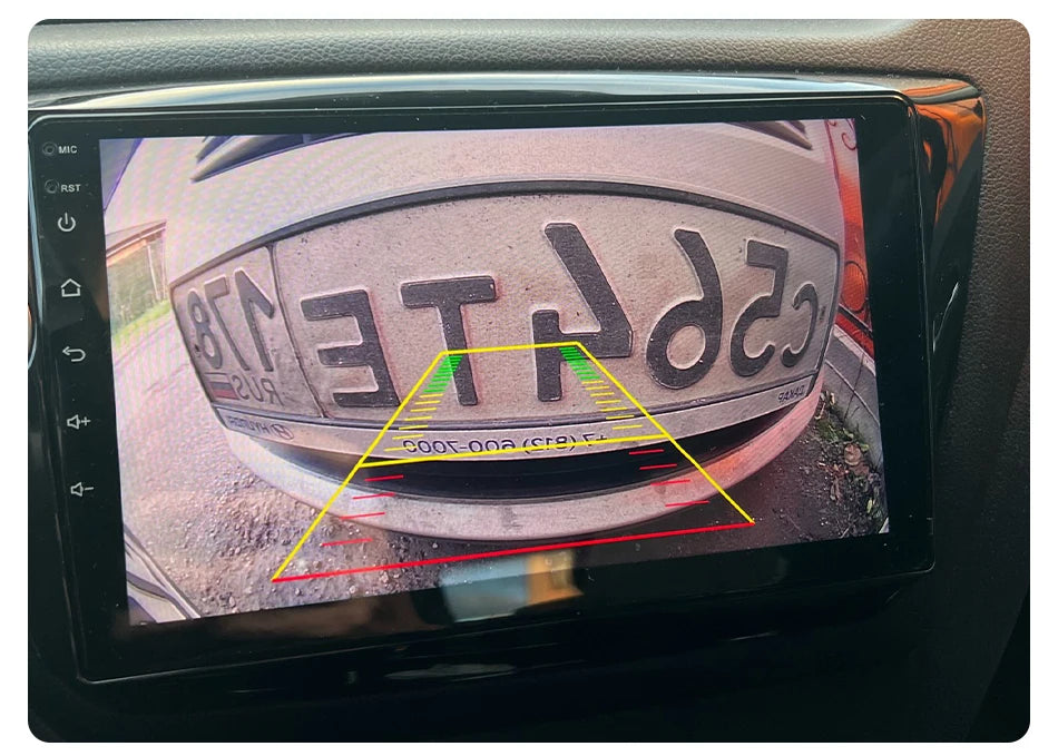 The Develuck HD 1080P 170° fisheye night vision car rear view camera from Lacatang Shop shows a close-up of the rear bumper and license plate, with colored guidelines indicating safe parking distances.