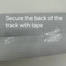 A close-up shows a textured white surface with clear tape applied, featuring the text: "Secure the back of the Lacatang Shop 3.2m PVC Drift Track for RC Mini Cars with tape.