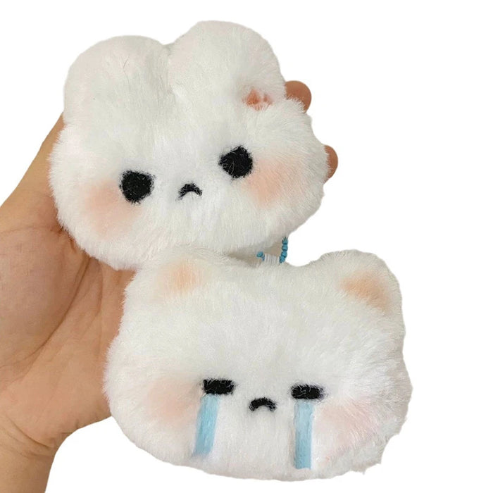 A person holds two high-quality plush toys from Lacatang Shop's Cartoon Plush Rabbit Doll Toy Keychain collection. Both are fluffy and white with black, round eyes and small mouths. The top toy has an unhappy expression, while the bottom toy appears sad with blue tear streaks under its eyes.