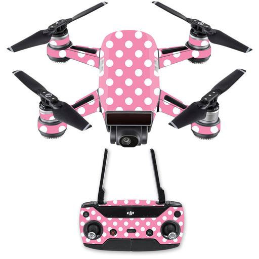 A small Rose Chloe DJI Spark Mini Drone, adorned with a playful pink and white polka dot MightySkins DJSPCMB-Mini Dots Skin Decal, comes with a matching remote controller. The drone features four propellers and a camera mounted on its front, offering both vibrant aesthetics and practical functionality.