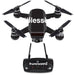 A DJI Spark Mini Drone Combo featuring a "Blessed" skin decal wrap by MightySkins, designed by Rose Chloe, comes with four propellers and a matching black remote control, both displaying the hashtag "#blessed." This setup is ideal for aerial photography and videography.