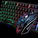 Here's a close-up image of the Ninja Dragons Z4 104 Keys LED Flame Gaming Keyboard with 2000 DPI mouse by Yellow Pandora. The keyboard boasts rainbow backlit keys with well-lit letters, while the mouse features an illuminated, intricate black and white pattern. The dark background further enhances their mechanical feel and glowing design.