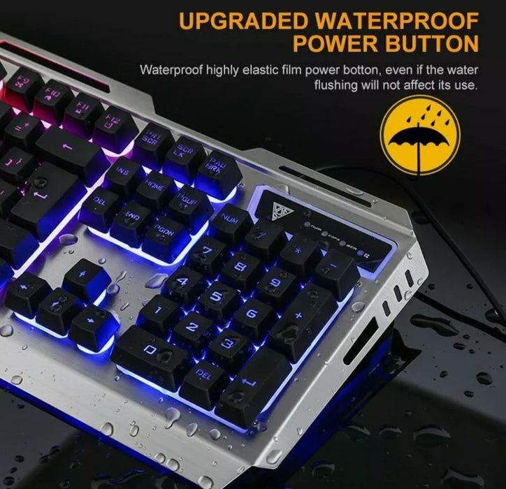 A close-up of a Yellow Pandora Ninja Dragon Metallic Silver Mechanical Gaming Keyboard with LED backlighting shows water droplets on the keys and surface. The text on the image reads, "Upgraded Waterproof Power Button" and "Waterproof highly elastic film power button, even if the water flushing will not affect its use," accompanied by an umbrella icon.