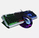 The Ninja Dragon Metallic Silver Mechanical Gaming Keyboard and Mouse Set by Yellow Pandora is a sleek, metallic design featuring seven-color breathing light RGB lighting. The keyboard has colorful backlit keys, while the mouse boasts a futuristic look with multiple illuminated sections. Both are connected with cables and placed on a white surface.