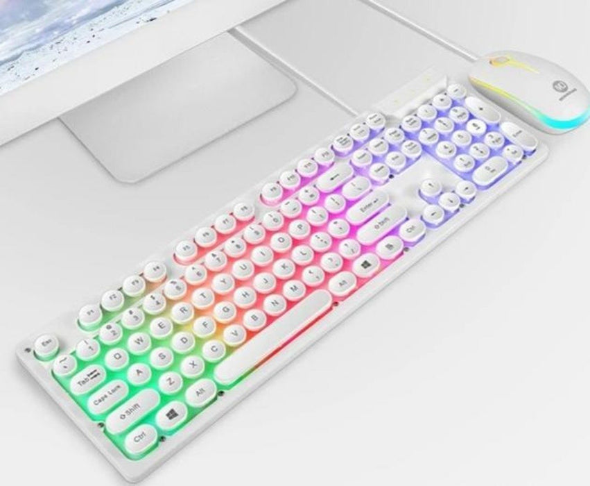 A sleek white Ninja Dragons Z9i USB Wired Light Up Gaming Keyboard and Mouse Set from Yellow Pandora, featuring round, typewriter-style keys illuminated by colorful RGB LED lights. Next to it is an ergonomic, RGB-lit white mouse with DPI adjustment, both connected to a white desktop computer visible in the background.